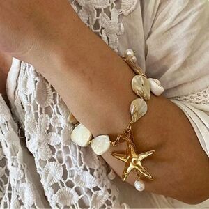 Anthropologie Gold and Pearl Starfish Charm Bracelet